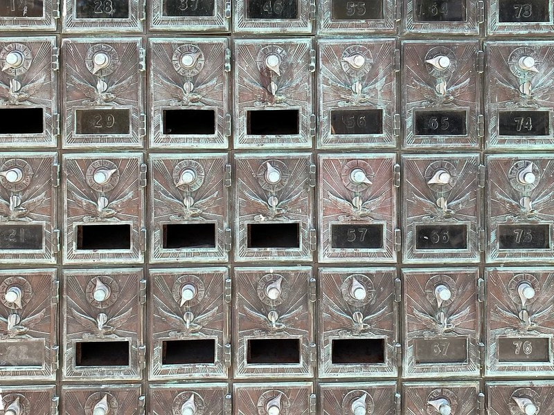 Photo of locking mail and package storage boxes